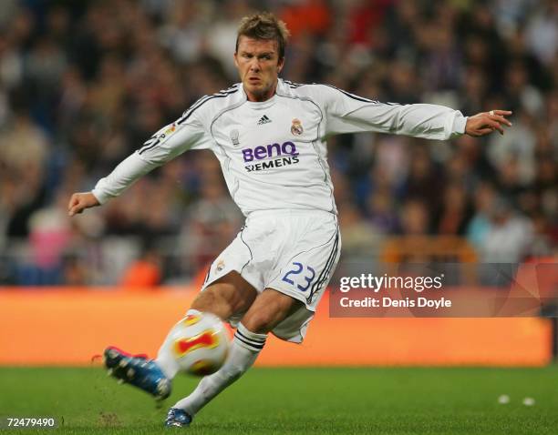 David Beckham of Real Madrid takes a free kick against Ecija during the Kings Cup fourth round second leg match between Real Madrid and Ecija at the...