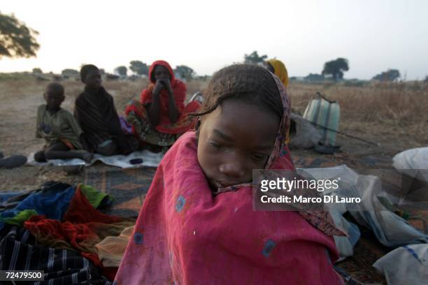 Young Chadian village women shelters under trees after fleeing an attack on her village on November 9, 2006 in a camp for internally displaced...