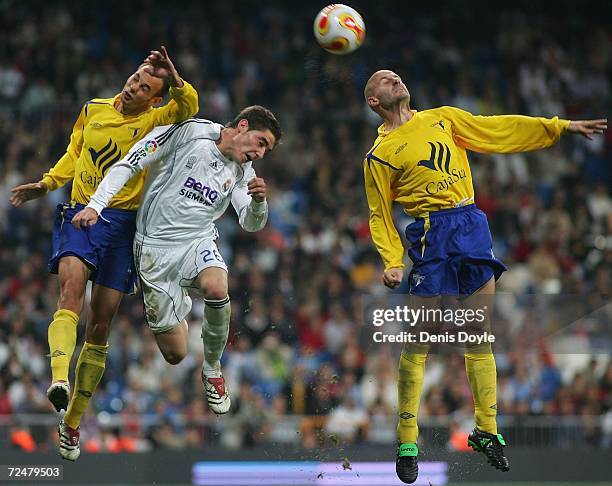 Jave Garcia of Real Madrid goes for a high ball against Pedro of Ecija in the Kings Cup fourth round second leg match at the Santiago Bernabeu...