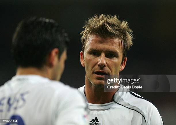 David Beckham of Real Madrid talks to Jose Antonio Reyes before taking a free kick uring the Kings Cup fourth round second leg match between Real...