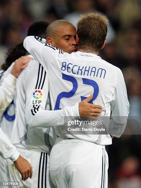 Ronaldo of Real Madrid celebrates with David Beckham after scoring a goal against Ecija in the Kings Cup fourth round second leg match at the...