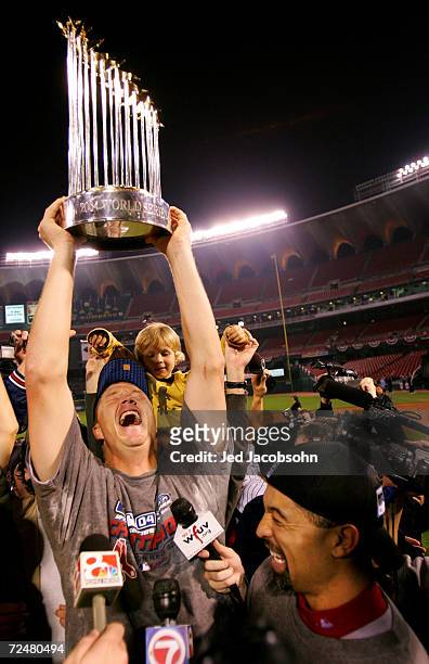 Mike Timlin of the Boston Red Sox celebrates on the field with his kids after defeating the St. Louis Cardinals 3-0 in game four of the World Series...