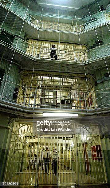 Prisoners at HMP Pentonville walk through an atrium May 19, 2003 in London. A new report from the Prison Reform Trust says overcrowding in Britain's...