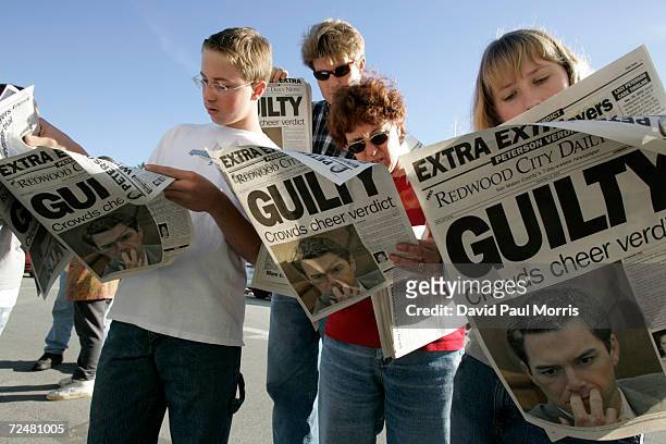 Twelve-year-old Danny Lewin, Geoff Shenk, Katherine Lewin and 12-year-old Katie Lewin, read Extra edition put out by the Redwood City Daily News...