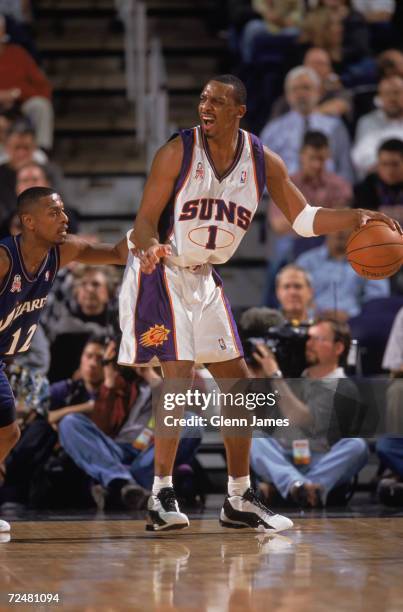 Guard Anfernee Hardaway of the Phoenix Suns posts up guard Chris Whitney of the Washington Wizards during the NBA game at the American Airlines Arena...