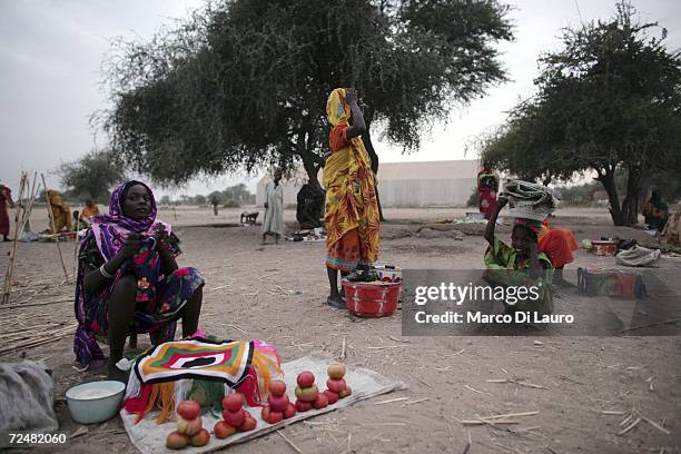 Sudanese refugee women sell what meagre goods they have at market on November 8, 2006 in the Goz Amer Refugee Camp, Chad. Since 2004 refugees have...