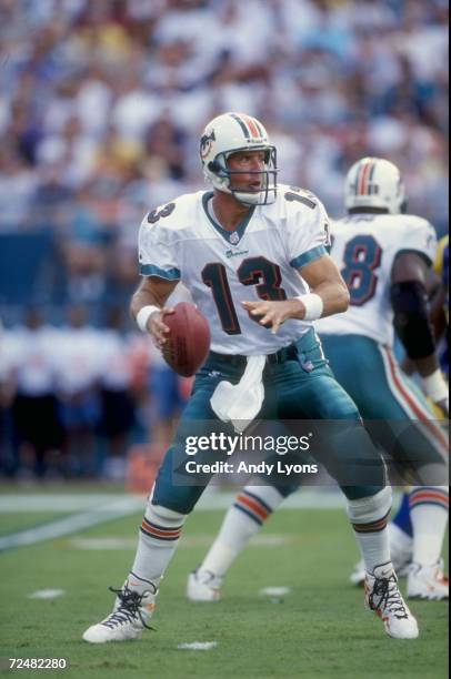 Quarterback Dan Marino of the Miami Dolphins looks to throw during a game against the St. Louis Rams at Pro Player Stadium in Miami, Florida. The...