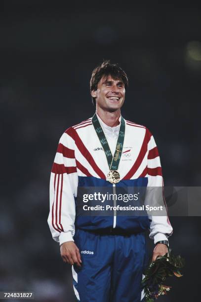 Czech javelin thrower Jan Zelezny of the Czechoslovakia team stands on the medal podium after receiving his gold medal for finishing in first place...