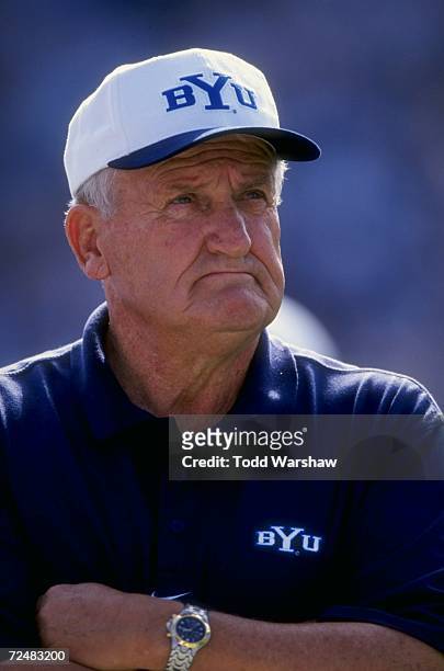 Portrait of head coach Lavell Edwards of the Bringham Young University Cougars as he watches the field during the game against the San Jose State...
