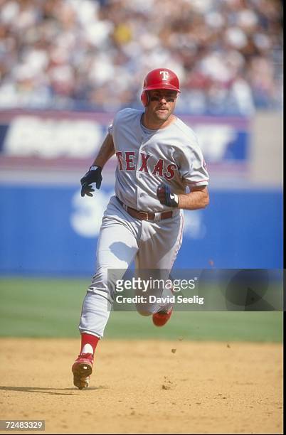 First baseman Will Clark of the Texas Rangers runs around the bases during a game against the New York Yankees at Yankee Stadium in the Bronx, New...