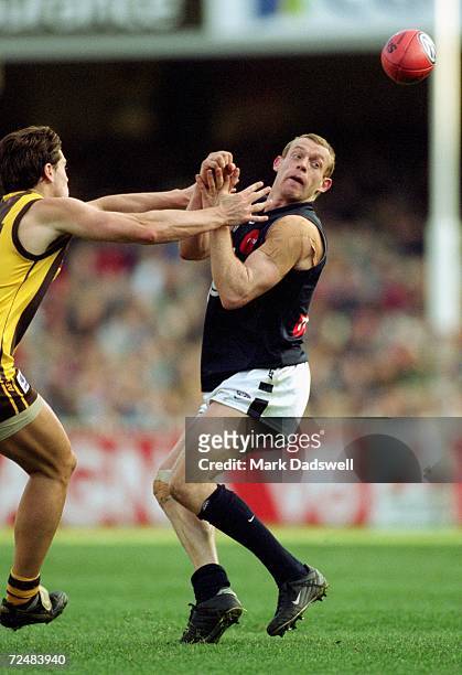 Adrian Hickmott for Carlton and Trent Croad for Hawthorn in action during the round 17 AFL match played between the Hawthorn Hawks and the Carlton...