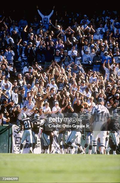 Defensive lineman Jerry Ball of the Oakland Raiders returns an interception for a touchdown during the Raiders 17-3 victory over the Jacksonville...