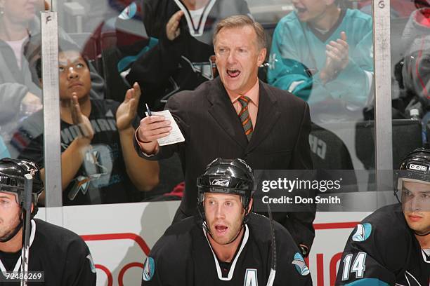 Head coach Ron Wilson of the San Jose Sharks follows the action from behind the bench during a game against the New York Rangers on November 2, 2006...