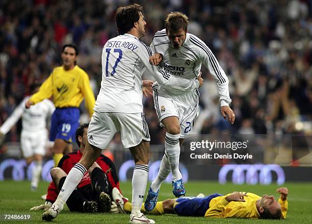 David Beckham of Real Madrid celebrates with Ruud van Nistelrooy after scoring a goal against Ecija during the Kings Cup fourth round second leg...
