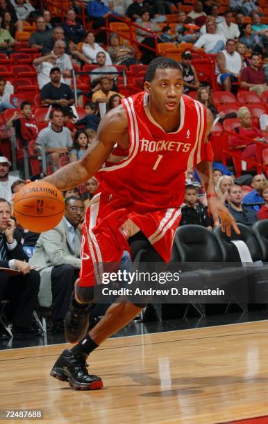 Tracy McGrady of the Houston Rockets moves the ball against the Miami Heat during the preseason game on October 25, 2006 at the AmericanAirlines...