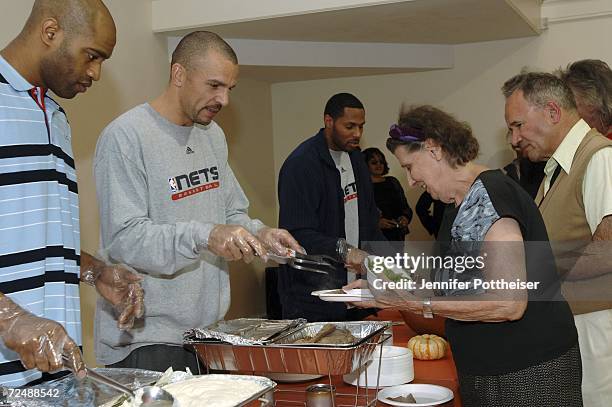 Vince Carter and Jason Kidd of the New Jersey Nets serve an early Thanksgiving meal at the Salvation Army on November 9, 2006 in Montclair, New...