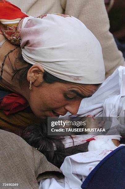 Kashmiri mother kisses the body of her daughter after an attack in southern Pulwama district Tahab village,about 40kms south of Srinagar, 10 November...