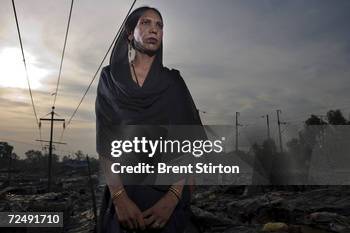 Trans-gendered sex-worker poses at his home in a slum in New Delhi, India in June 2006. Trans-gender men live as women and are all HIV positive. They...