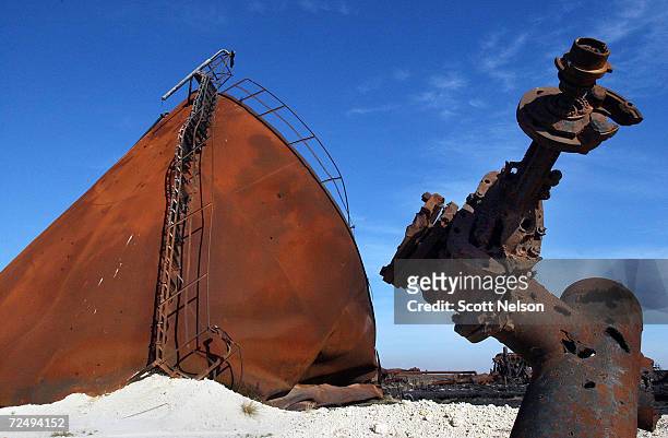 An oil collection facility lies in ruins in the giant Burgan oil field January 13, 2003 in Central Kuwait. The oil field, the largest in the world,...