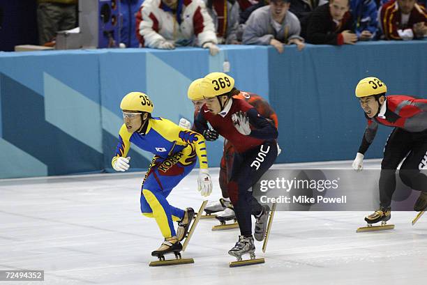 Apolo Anton Ohno of the USA is ''cross-checked'' by Dong-Sung Kim of Korea in the Men's 1500m Short Track Speed Skating final during the Salt Lake...