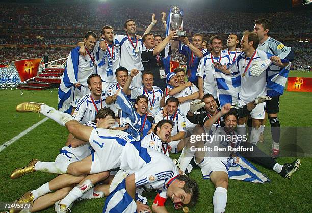 Greece celebrate with the trophy after winning the UEFA Euro 2004, Final match between Portugal and Greece at the Luz Stadium on July 4, 2004 in...