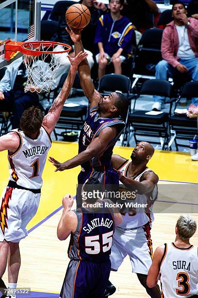 Alton Ford of the Phoenix Sus drives to the basket for a layup against the Golden State Warriors during the NBA Game at The Arena In Oakland in...