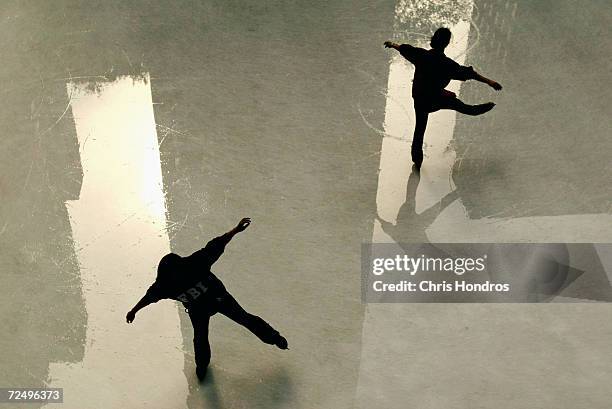 Skaters glide over the ice and reflections of nearby skyscrapers at Rockefeller Center October 21, 2003 in New York City. Despite unusually high...