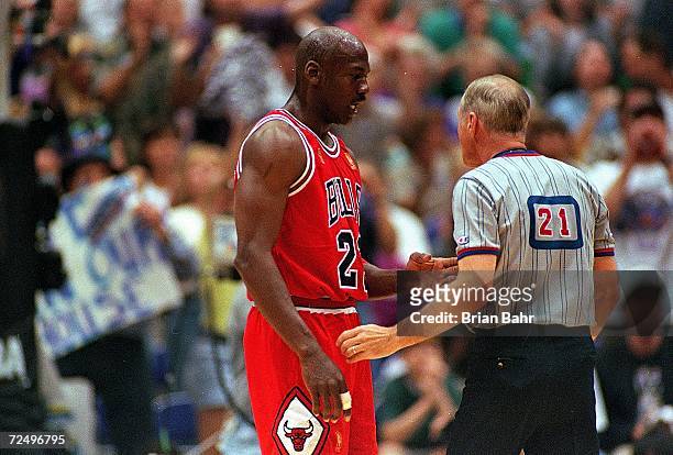 Michael Jordan of the Chicago Bulls talks to the referee during game five of the NBA Finals against the Utah Jazz at the Delta Center in Salt Lake...