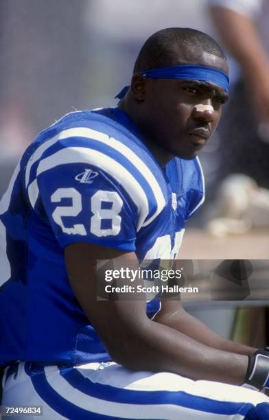 Running back Marshall Faulk of the Indianapolis Colts looks on during the game against the Miami Dolphins at the Pro Player Stadium in Miami,...