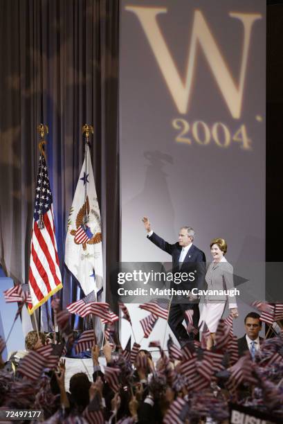 President George W. Bush and first lady Laura Bush walk out on stage at a victory rally in the Ronald Reagan building November 3, 2004 in Washington,...