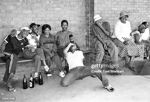 Employees of Gold Fields Ltd relax after work at the Kloof Gold Mine near Carltonville, South Africa. The company provides a beer garden where miners...