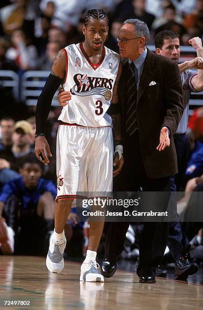Allen Iverson of the Philadelphia 76ers discusses a play with coach Larry Brown during the game against the Charlotte Hornets at the First union...