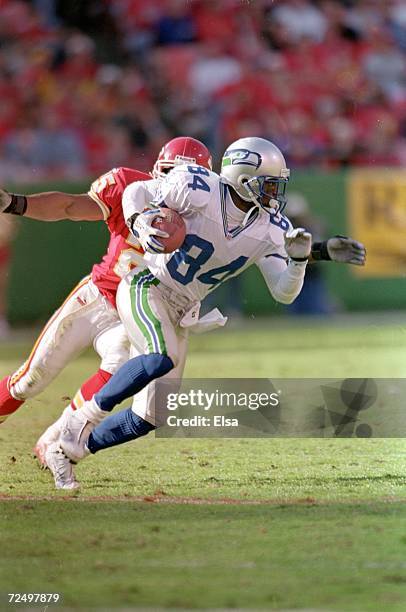 Joey Galloway of the Seattle Seahawks carries the ball during a game againat the Kansas City Chiefs at the Arrowhead Stadium in Kansas City,...