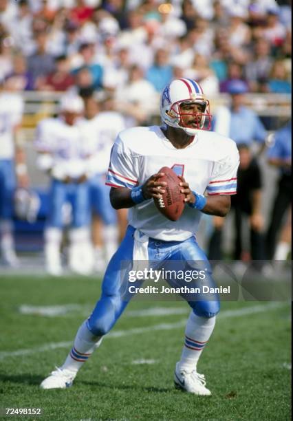 Quarterback Warren Moon of the Houston Oilers in action during a game against the Chicago Bears at Soldier Field in Chicago, Illinois. The Oilers won...