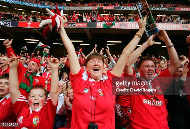 Welsh fans celebrate as Wales win the Grand Slam after defeating Ireland in the RBS Six Nations International between Wales and Ireland at The...