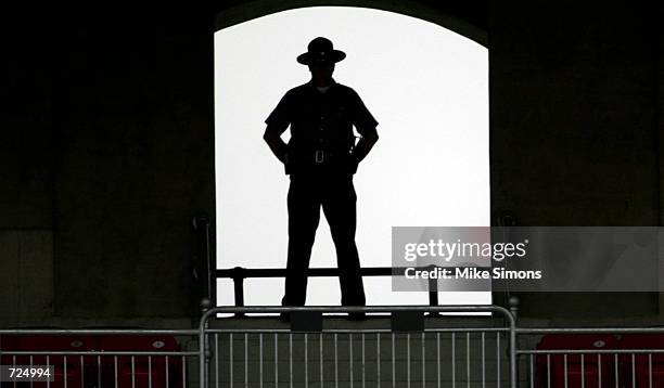 Security officer stands guard at the Ohio State University Spring commencement June 14, 2002 in Columbus, Ohio. U.S. President George W. Bush gave...