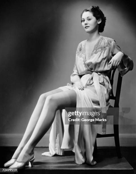 Woman putting on white stockings Stock Photo by ©pvstory 102670588