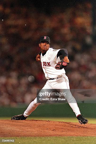 Pedro Martinez of the American League Team winds back to throw during the 1999 MLB All-Star Game against the National League Team at Fenway Park in...