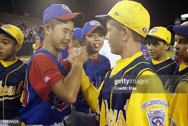 Hirofumi Yamazaki of Japan shakes hands with Matt Overton of Boynton Beach, Florida after the Little League World Series on August 24, 2003 at Lamade...