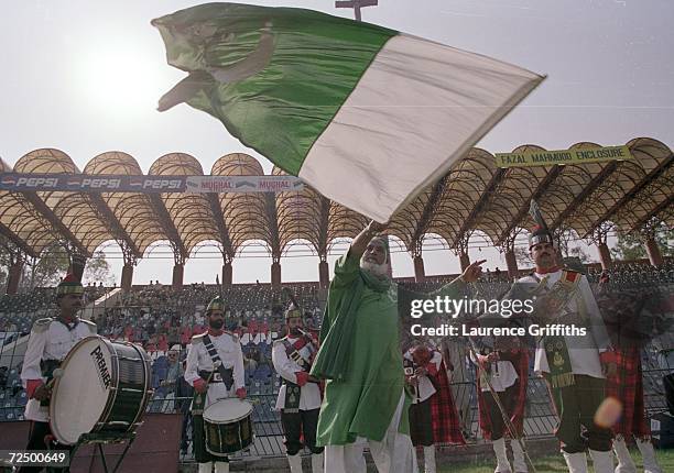 Pakistan fan flies the flag during the first Test Match against England at the Gaddafi Stadium in Lahore, Pakistan. \ Mandatory Credit: Laurence...