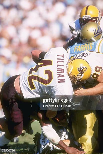 Linebacker Pat Tillman of the Arizona State Sun Devils tackles running back Skip Hicks of the UCLA Bruins during a game at the Rose Bowl in Pasadena,...