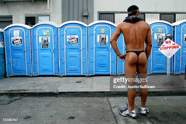 An unidentified man waits to use a restroom at the 20th Annual Folsom Street Fair September 28, 2003 in San Francisco, California. The annual fair...