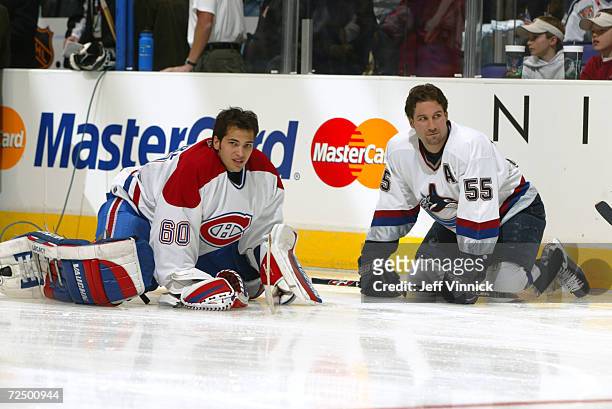 Jose Theodore of the Montreal Canadiens and Ed Jovanovski of the Vancouver Canucks during the NHL Allstar Skills competition at the Staples Center in...