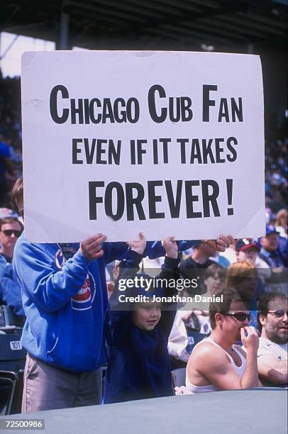 General view of fans holding a banner during a game between the San Francisco Giants and the Chicago Cubs at Wrigley Field in Chicago, Illinois. The...