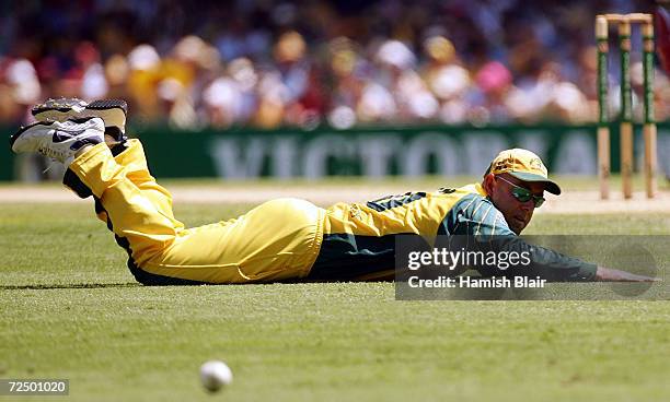 Darren Lehmann of Australia dives but doesn't stop the ball during game four of the VB Series One Day International Tournament between Australia and...