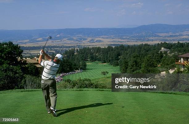 Golfer hits a tee shot on the first hole of the Castle Pines Golf Course during the 1994 International in Castle Rock, Colorado. Mandatory Credit:...