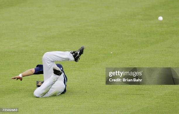 Shin-Soo Choo of the Seattle Mariners misses a shot to right field during a spring training game against the Milwaukee Brewers on March 4, 2005 at...