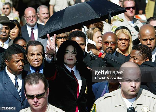 Singer Michael Jackson leaves the courthouse with his father, Joe Jackson and his mother Katherine Jackson, after his arraignment where he pleaded...