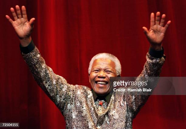 Nelson Mandela waves to the crowd after speaking at the Colonial Stadium for the World Reconciliation Day Concert September 8, 2000 in Melbourne,...