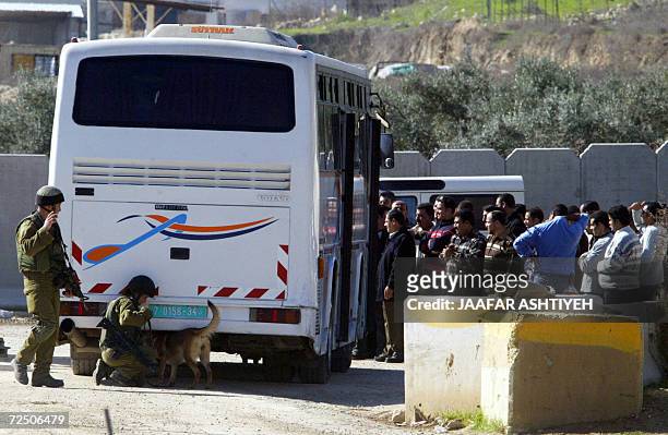 Israeli soldiers stop and search buses loaded with Palestinians headed from the West Bank town of Nablus to Ramallah, where thousands of Palestinians...